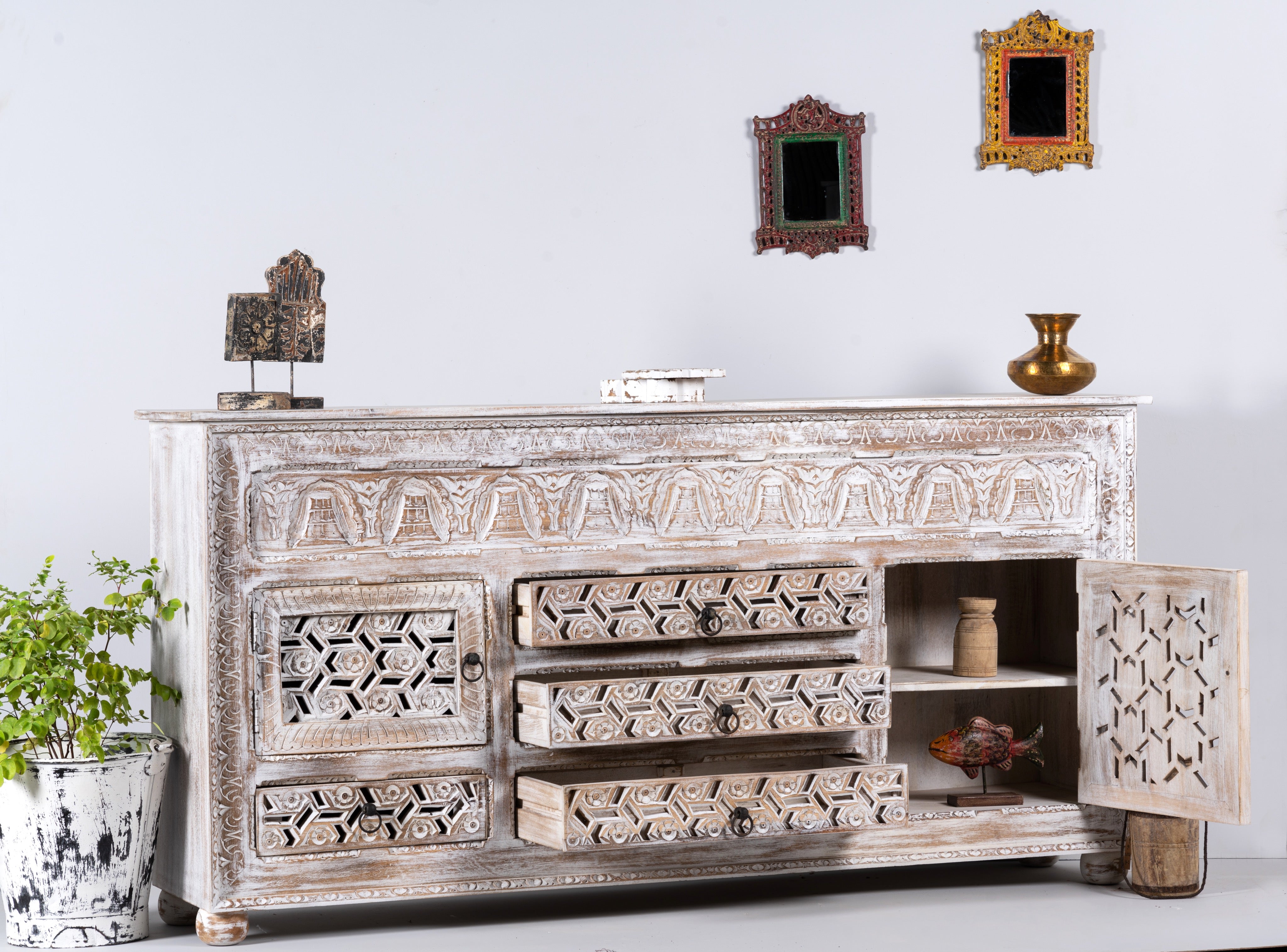 Open drawer image of a hand-carved wooden sideboard made from solid mango wood with drawers and compartments; unique furniture piece in Mediterranean style, 180 × 100 × 40 cm.