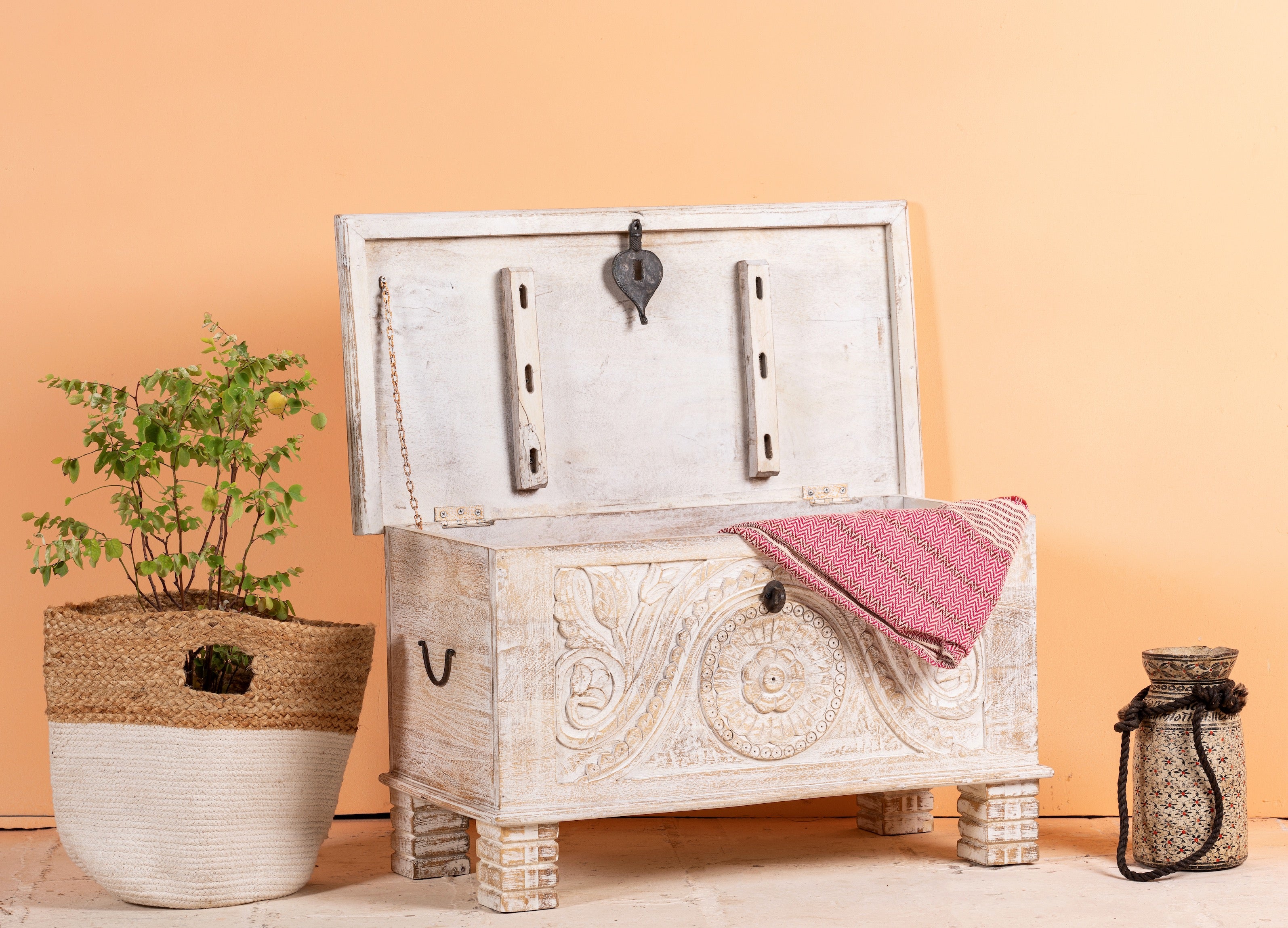 Side angle image with open lid of a hand‑carved mango wood chest with floral detailing – vintage home accessories and artisan storage chest for stylish interiors.