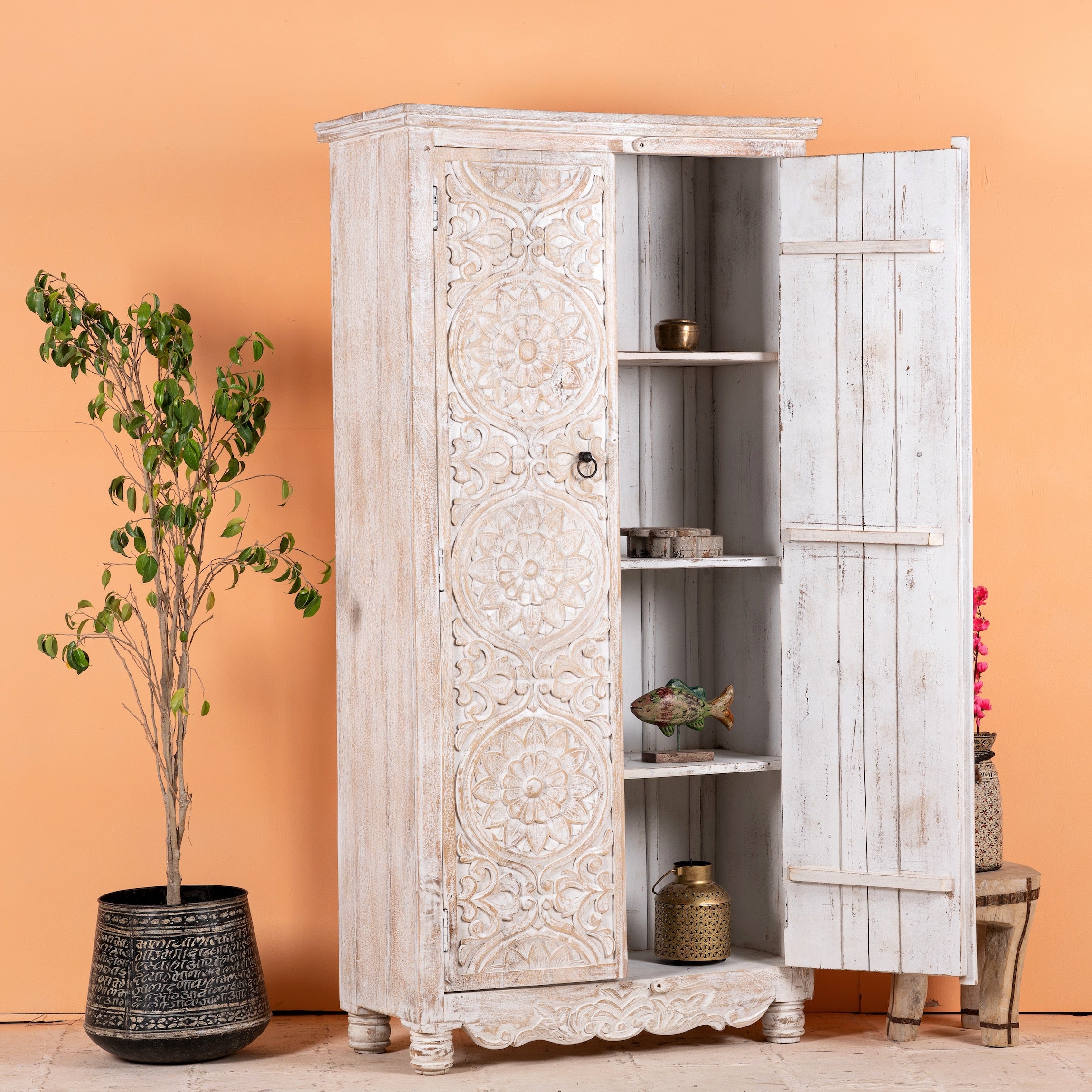 Open door image of a hand-carved mango wood wardrobe with whitewashed finish; wooden wardrobe perfect for living room furniture or bedroom storage, 180 × 90 × 40 cm.