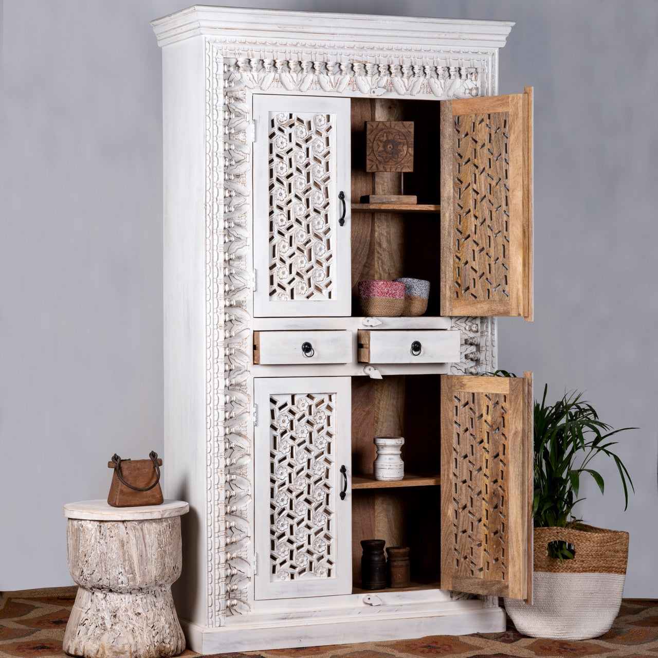 Open door image of a hand-carved mango wood cabinet with shelving and whitewashed finish, bedroom furniture with floral and geometric motifs, 190 × 105 × 40 cm.