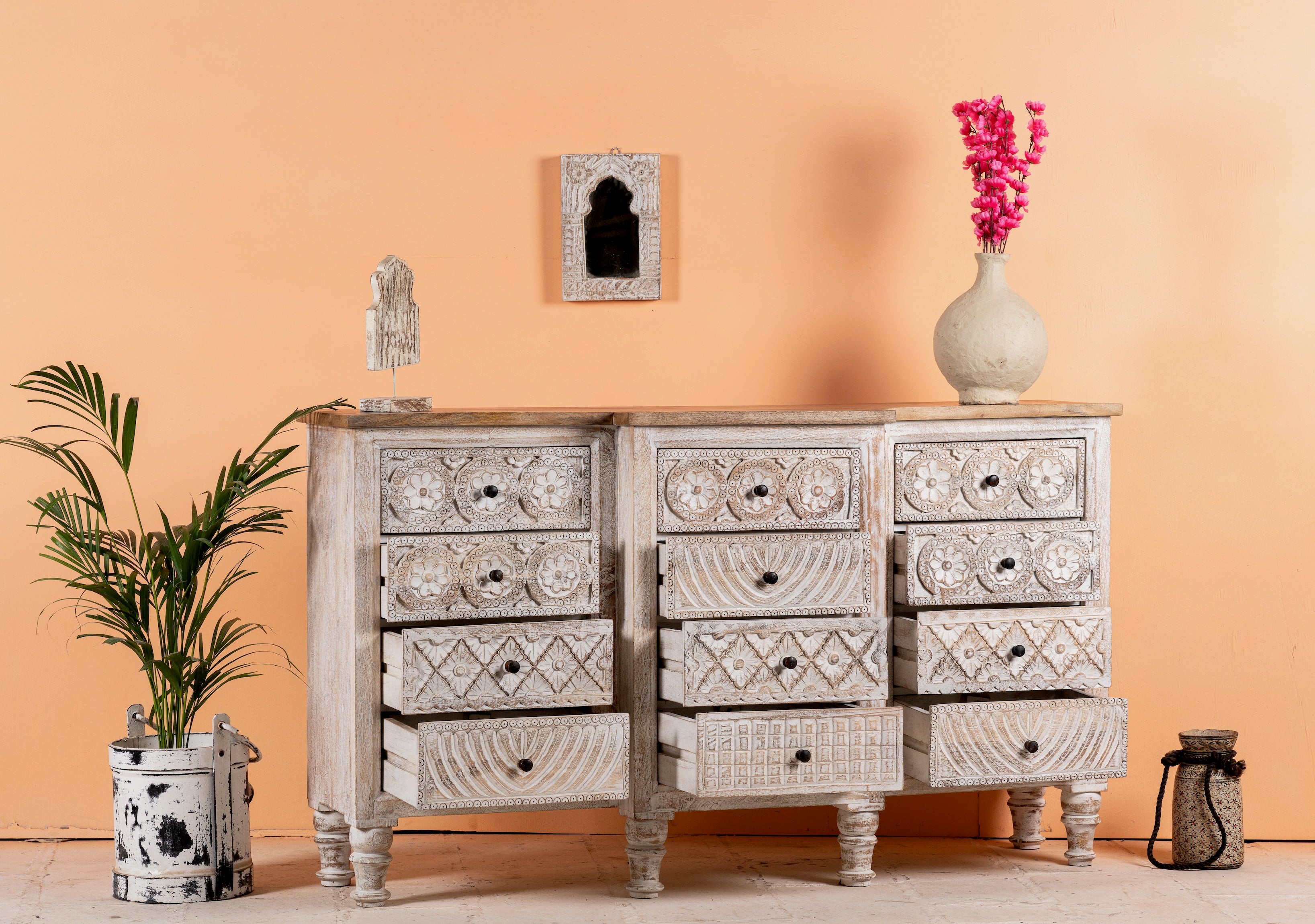 Open drawer image of a hand-carved mango wood sideboard with lotus-inspired drawer motifs and whitewashed finish; a wood carved sideboard and unique furniture piece, 160 × 92 × 45 cm.