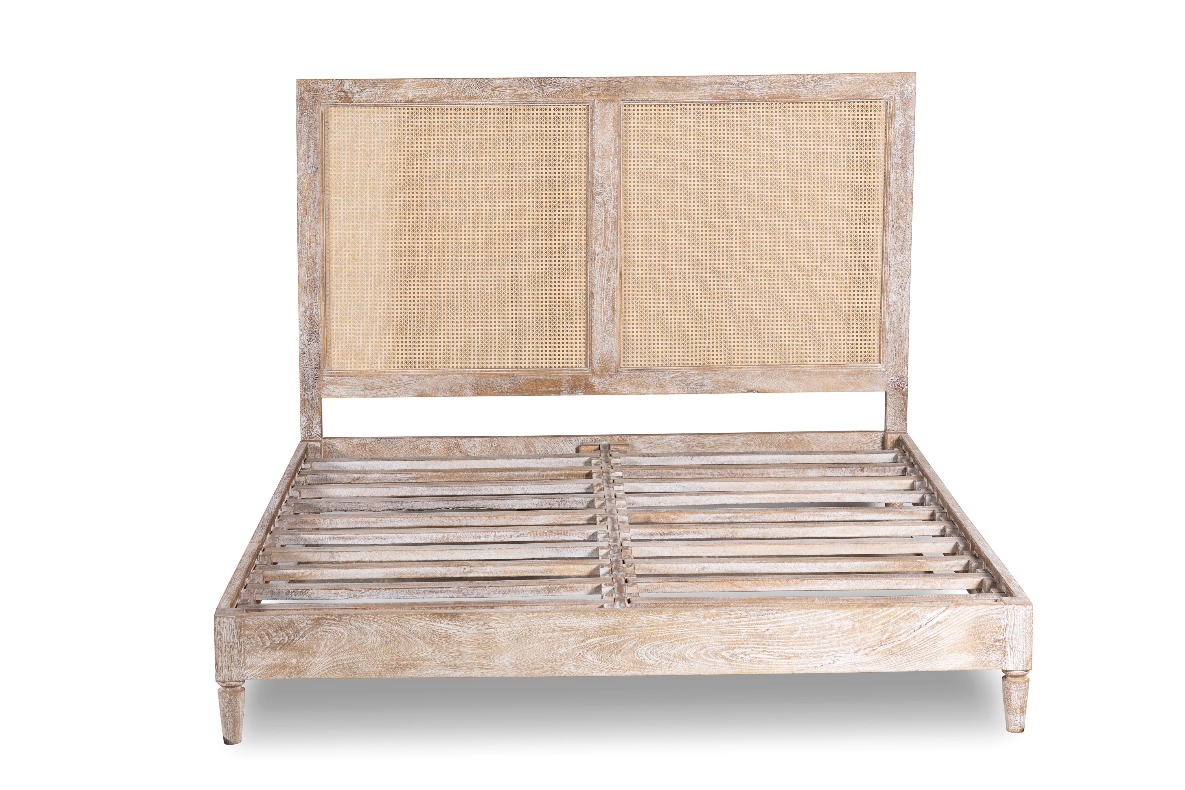 White background image of a handcrafted Indian bed Tapti in solid mango wood with rattan panels, artisanal bedroom furniture, 180 × 200 cm.