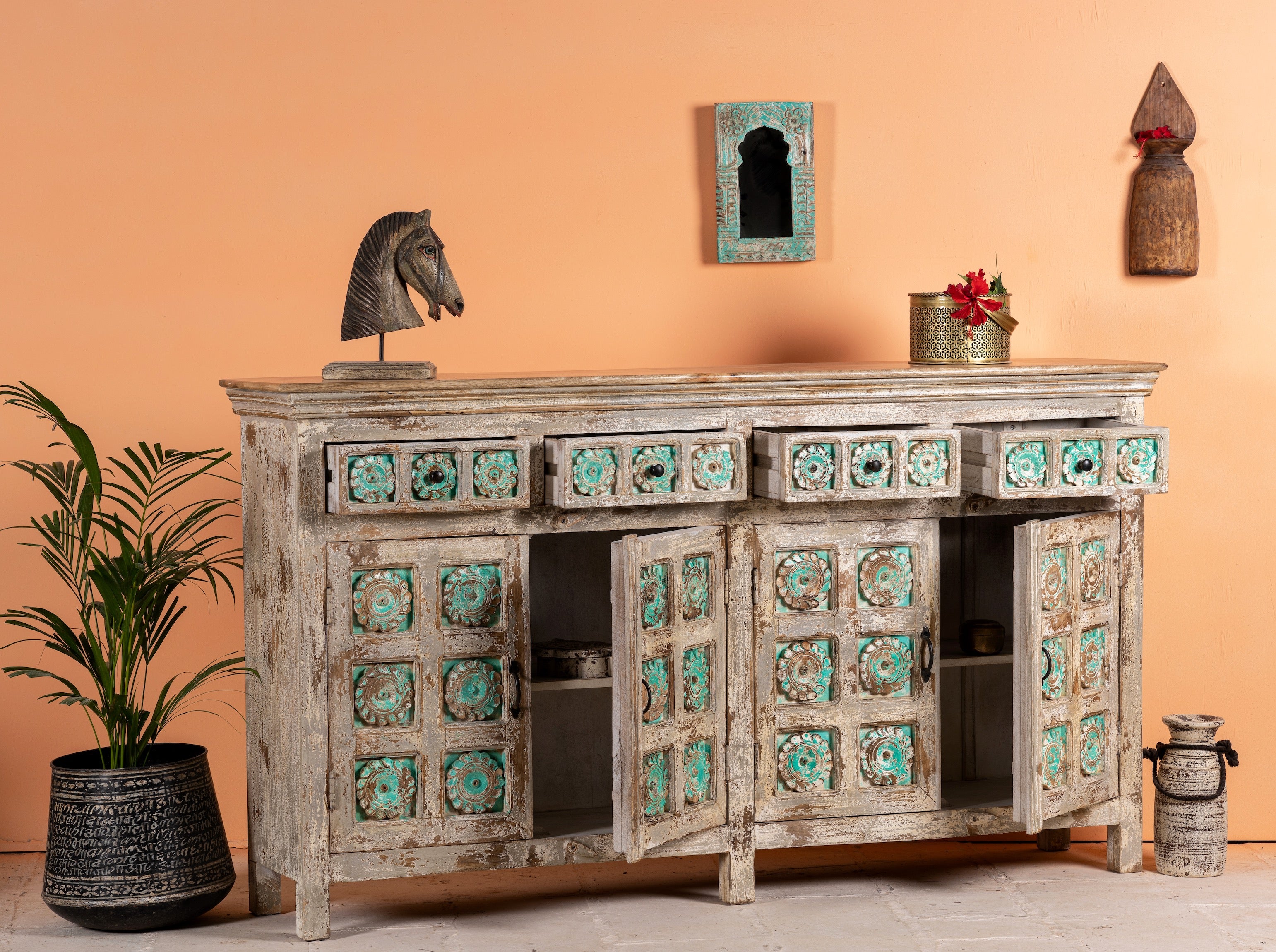Open door image of a hand-carved mango wood sideboard with green floral accents and vintage finish; perfect for bedroom furniture and bohemian interior style, 180 × 100 × 40 cm.