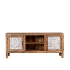 White background picture of a Mango wood low board featuring hand-carved floral motif doors with whitewashed detailing, open central shelving, and a warm natural wood finish.