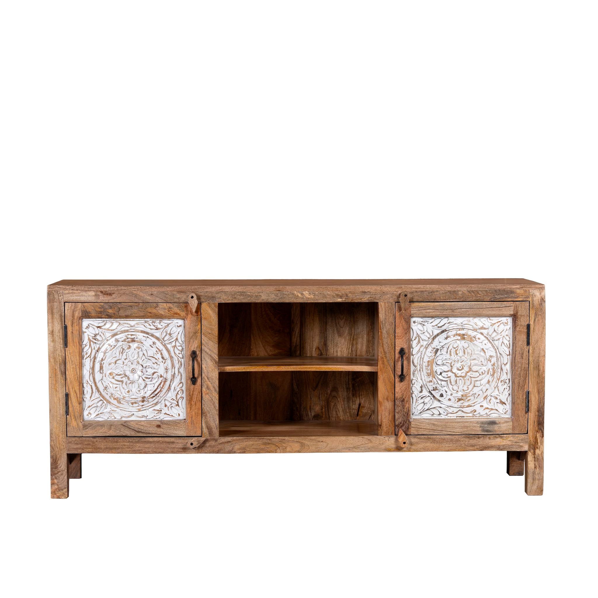 White background picture of a Mango wood low board featuring hand-carved floral motif doors with whitewashed detailing, open central shelving, and a warm natural wood finish.