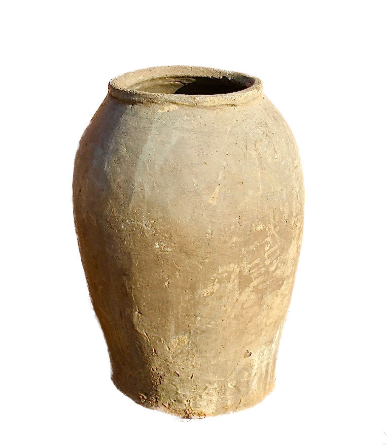 White background image of an antique-style Indian clay vase with wide body – a Bali style clay vase perfect for Indian home decoration and boho-inspired interiors.