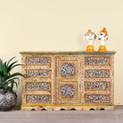 Hand-painted reclaimed wood sideboard with floral motifs – a unique piece of sustainable furniture for vibrant Indian home decor.