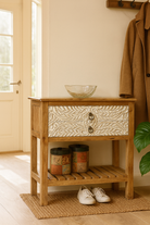 Lifestyle imagination of a white washed mango wood console table with floral hand-carved drawers and lower shoe shelf; rustic mango wood furniture, 90 × 40 × 75 cm.

