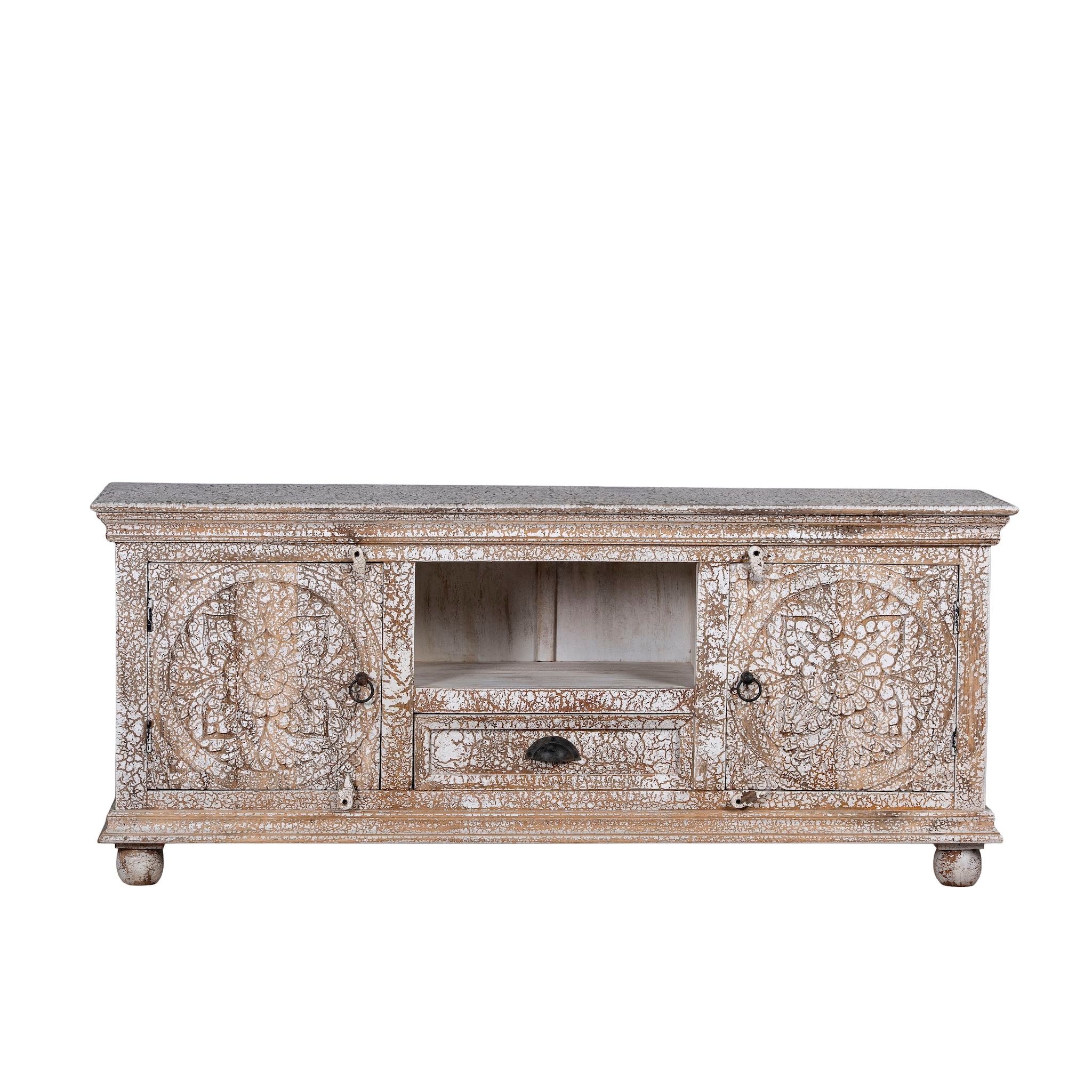 Decorative wooden TV stand with intricate carvings on a white background