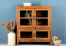 Reclaimed teak wood display cabinet with four glass-panelled doors – wooden showcase cabinet crafted as sustainable furniture with timeless appeal.