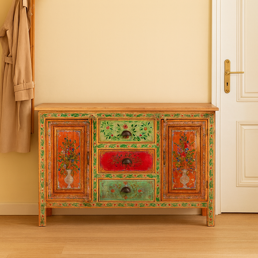 Lifestyle image of a sustainable hand painted sideboard made from reclaimed teak wood with floral motifs; bold bohemian furniture, 150 × 45 × 90 cm.