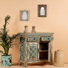 Image with open drawers of a hand painted cabinet made from reclaimed wood with colourful traditional Indian motifs, 90 × 90 × 40 cm.