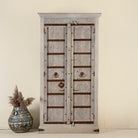 Old door cabinet with reclaimed teak doors, floral carvings, and iron accents; artisan teak wood wardrobe with mango wood frame, 100 × 44 × 206 cm.