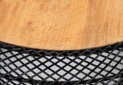 Close up image of a large round metal base coffee table with recycled wooden top and woven iron base; minimalistic style coffee table, 100 cm diameter, 45 cm height.