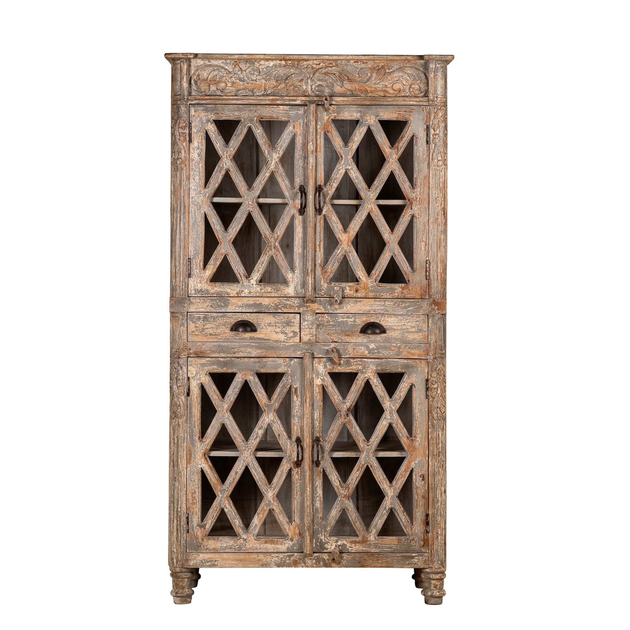 White background image of a handcrafted showcase cabinet made from reclaimed wood, featuring diamond-pattern glass pane doors, a crackled paint finish in earthy tones, two drawers, and vintage-inspired detailing.