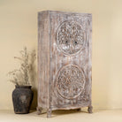 Side angle image of a vintage style wardrobe with Tree of Life design, hand-carved mango wood furniture with four storage compartments, 90 × 40 × 180 cm.