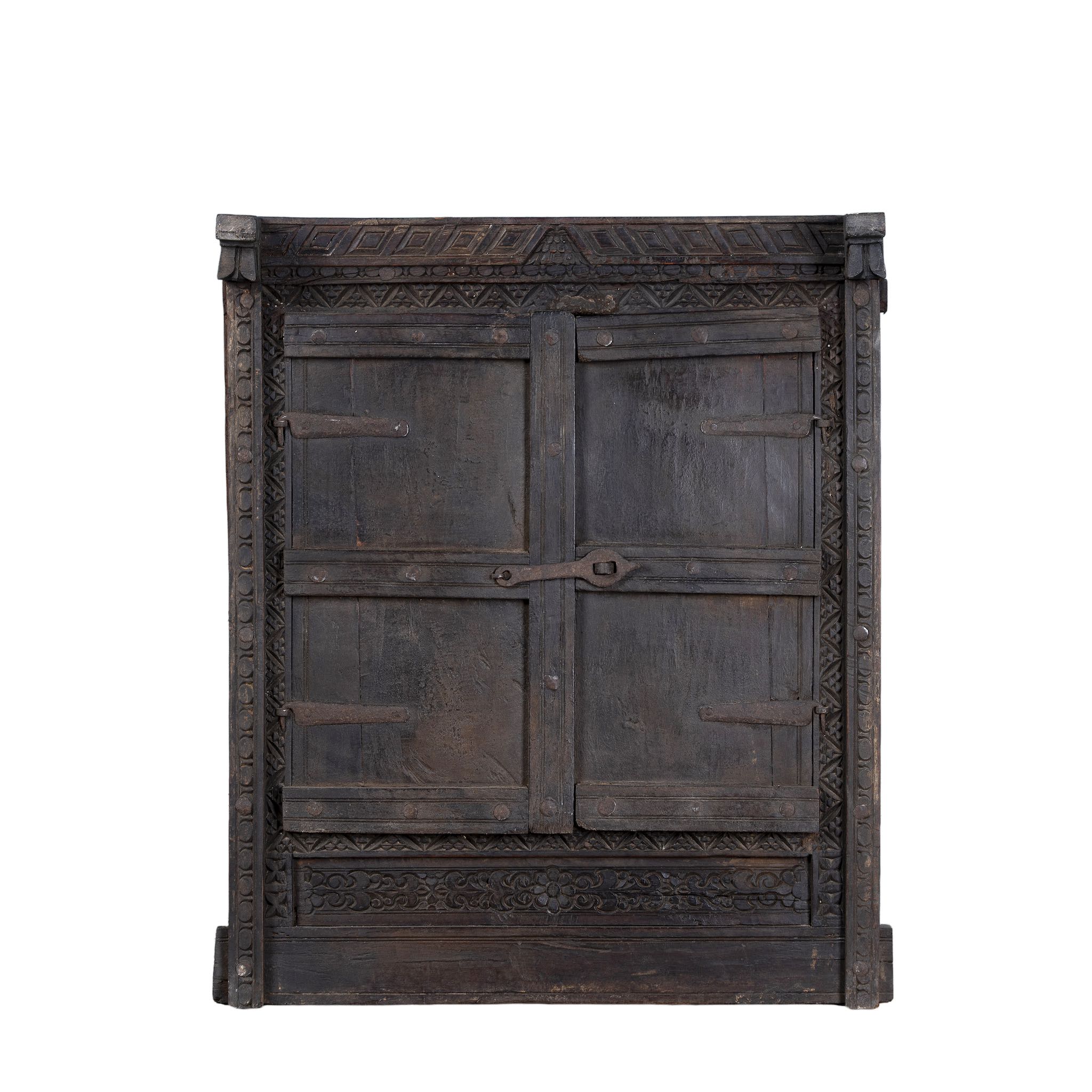 White background picture of a reclaimed teak wood mirror with functional window shutters, showcasing vintage craftsmanship and rustic carved accents.