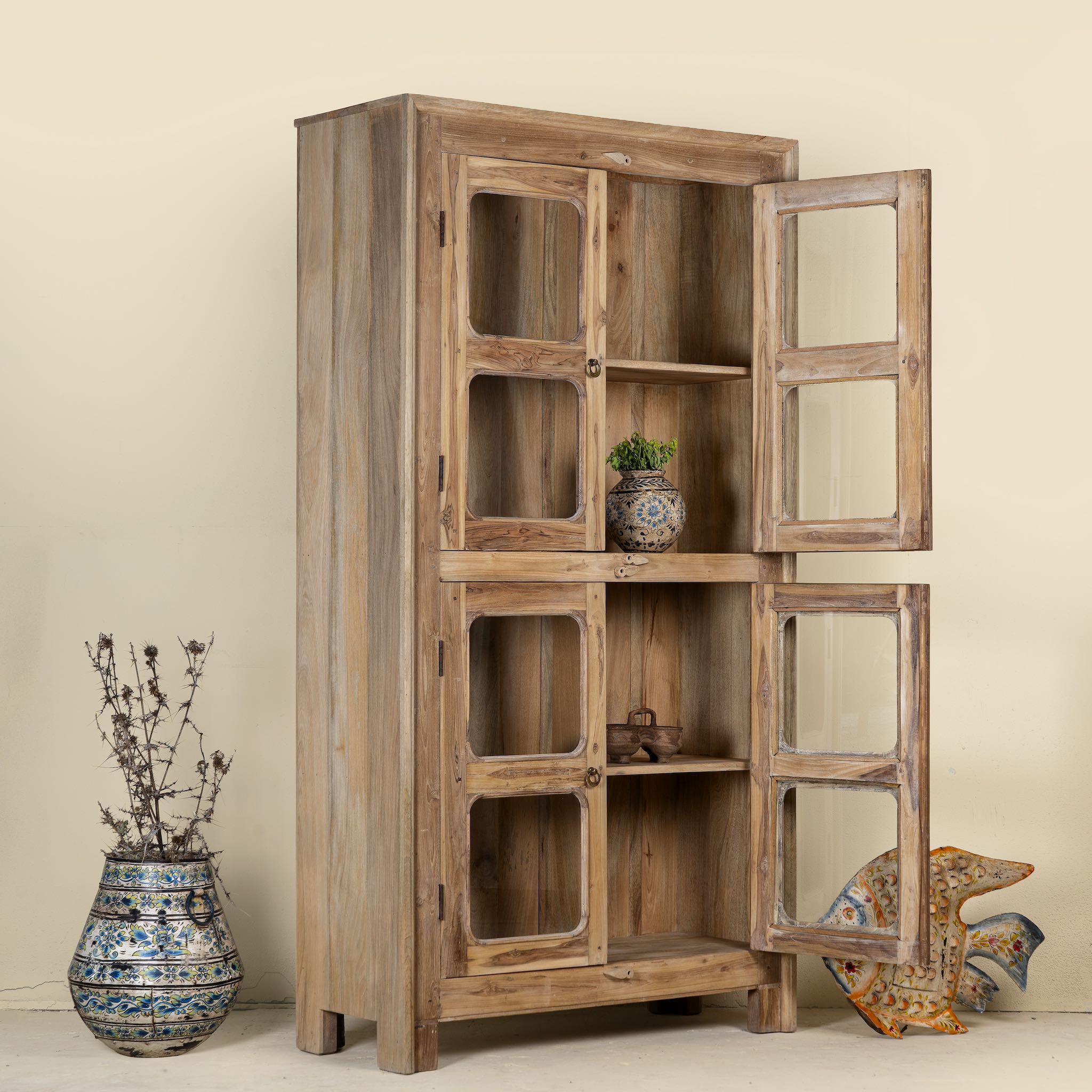Wooden cabinet with glass doors on a beige background