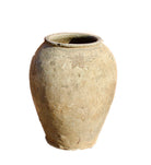 Close up image of an antique Indian clay vase with weathered surface – a Bali style clay vase ideal for Indian home decoration and rustic bohemian interiors.