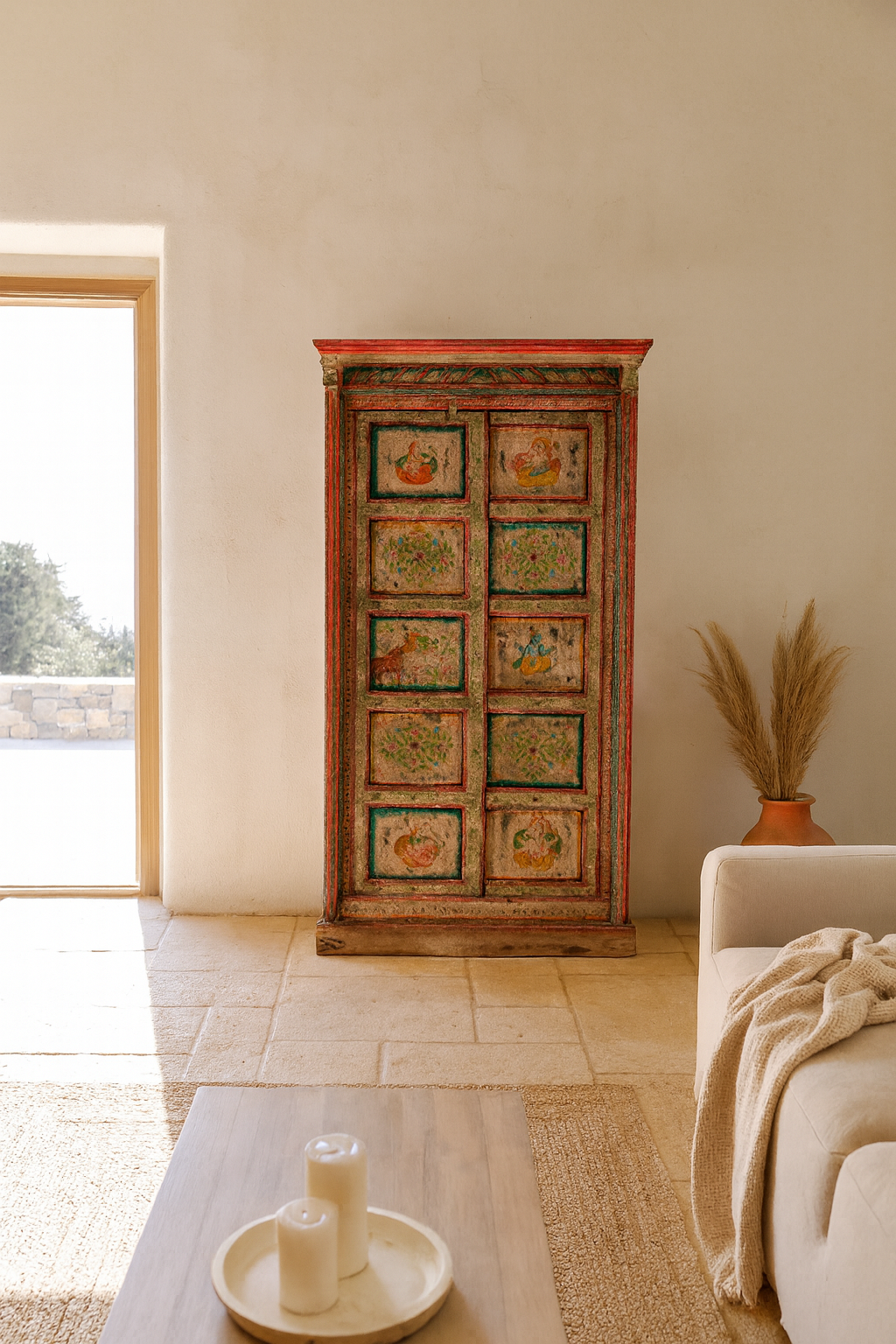 Lifestyle image of a antique hand painted wardrobe made from reclaimed teak wood with Indian motifs; unique furniture and teak wood furniture, 113 × 50 × 190 cm.