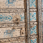 Close up image of an antique hand-painted Indian teak wood door with floral and elephant motifs; vintage Indian doors for wooden wall decoration, 128 × 10 × 250 cm.