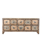 Wite background image of a hand painted mango wood chest of 10 drawers with elephant and floral motifs; hand painted furniture for a boho chic living room, 200 × 41 × 85 cm.