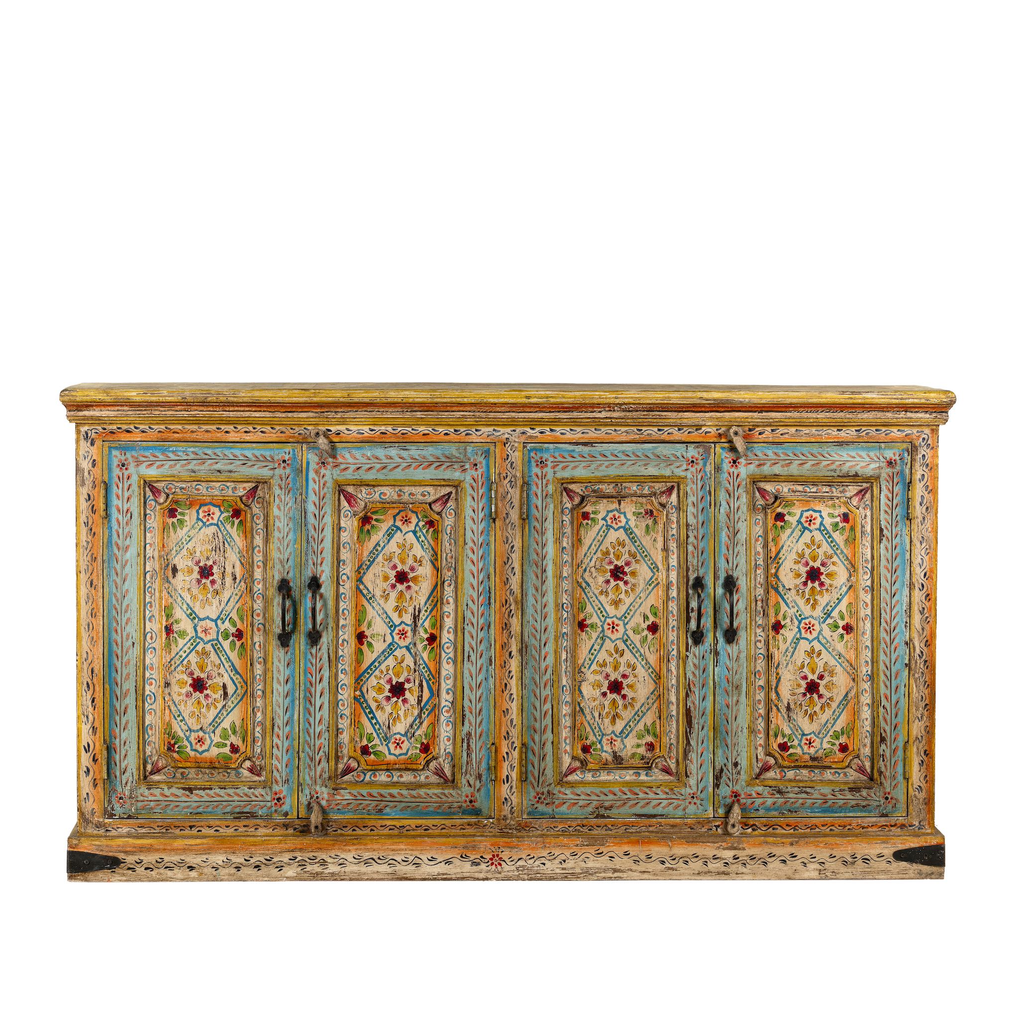 White background image of a hand-painted sideboard made from reclaimed wood, featuring four intricately detailed doors with vibrant floral and geometric motifs in soft blues, yellows, and reds, finished with a distressed vintage patina for a charming, artisanal look.

