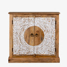 White background image of a carved wood furniture cabinet made from mango wood with floral whitewashed doors, 90 × 40 × 90 cm.
