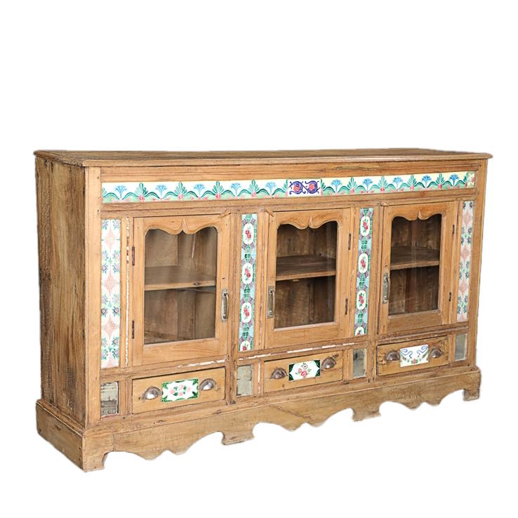 Side angle image of an antique Portuguese style South Indian glass display case made from reclaimed teak wood with ceramic inlays – sustainable teak wood furniture with historical and cultural elegance.