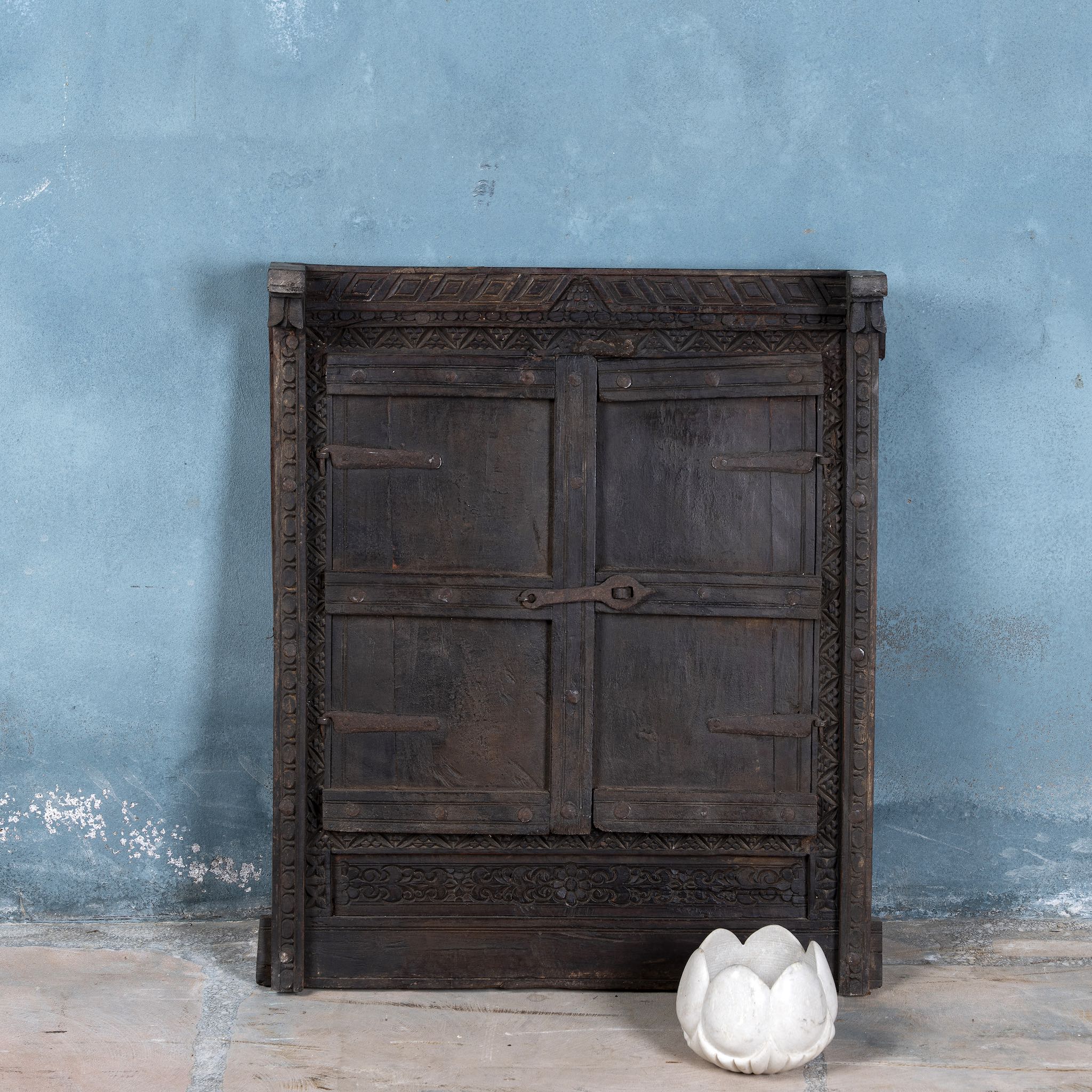 Antique mirror crafted from an old teak wood window with original shutters and detailed hand carvings.