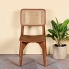 Acacia wood chair with woven rattan backrest and solid wooden frame; wooden armchair for dining or living rooms, 45 × 45 × 85 cm.