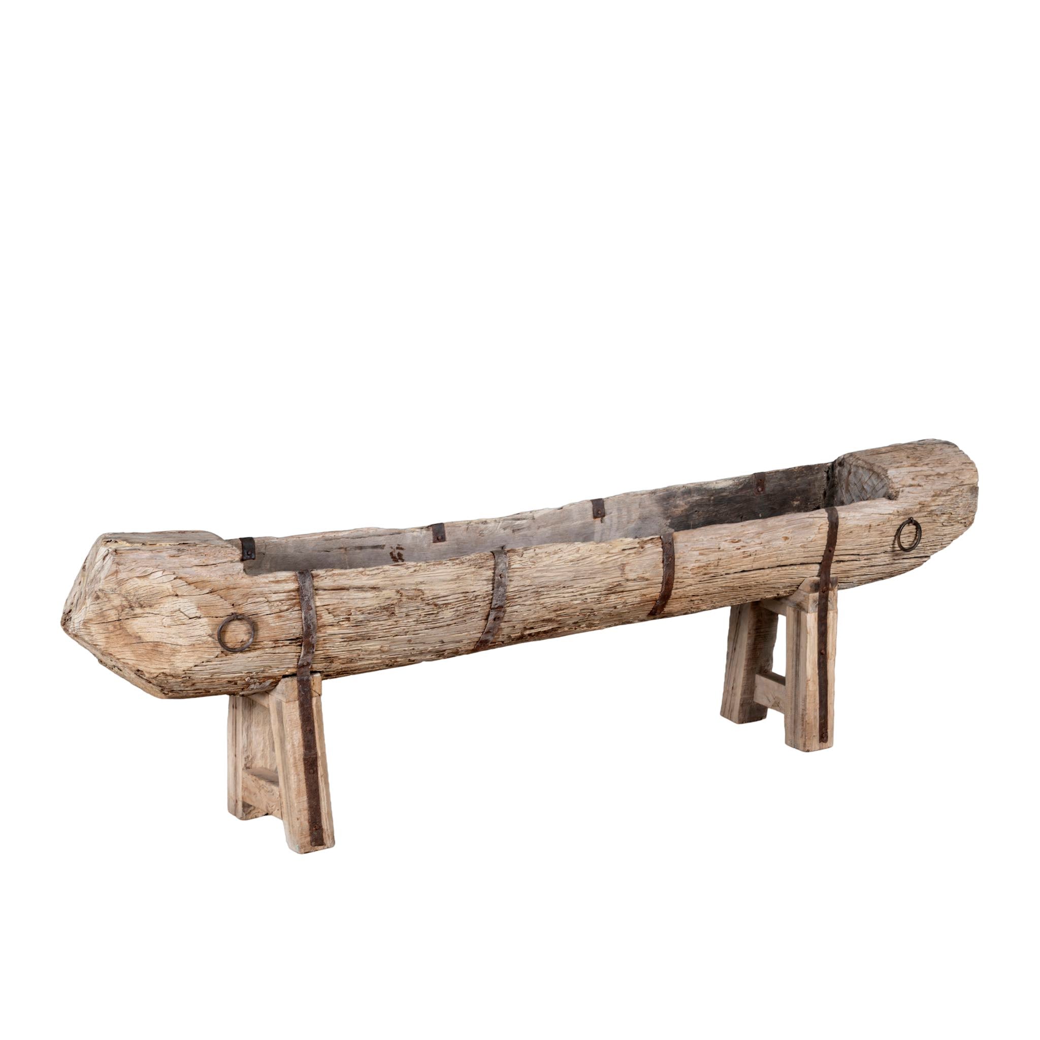 Wooden log planter on a white background