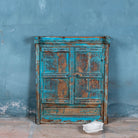 Reclaimed teak wood blue mirror with functional window shutters, showcasing vintage craftsmanship and rustic carved accents.