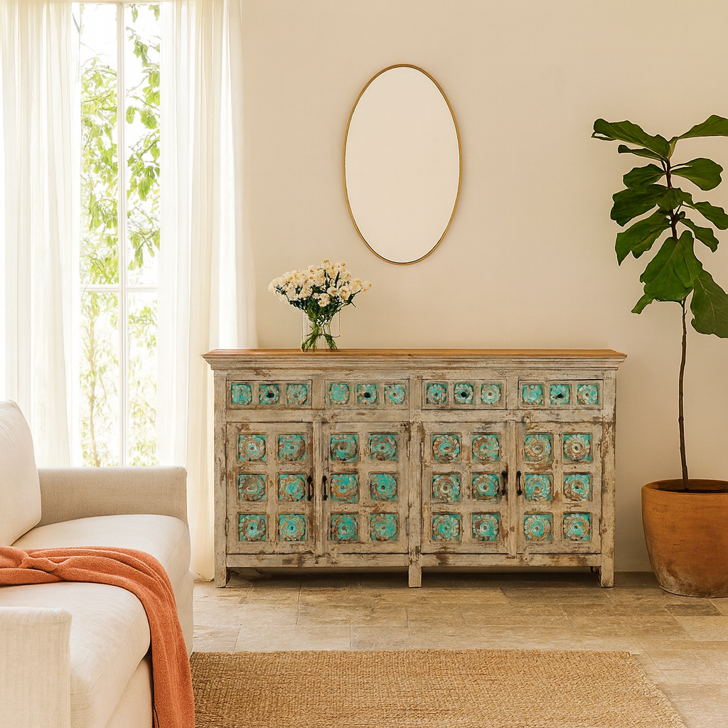 Lifestyle imagination of a hand-carved mango wood sideboard with green floral accents and vintage finish; perfect for bedroom furniture and bohemian interior style, 180 × 100 × 40 cm.