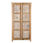 White background image of a and carved wooden wardrobe made of solid mango wood with whitewashed floral details; Ibiza-style mango wood wardrobe, 190 × 100 × 40 cm.