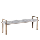 White background picture of a Japandi style wooden bench with hand woven seating in a mediterrane scene.