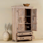 Side angle image with open doors of a hand-carved mango wood cabinet with floral and geometric detailing – carved wooden furniture and elegant bedroom storage by Om Home & Garden.