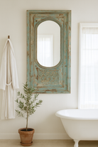 Lifestyle imagination of a tall vintage wall mirror with hand-carved mango wood frame; rustic hand carved mirror, 86 × 160 × 5 cm.