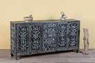 Side angle image of a hand-painted black and white sideboard made of reclaimed wood – Kaira model by Om Home & Garden