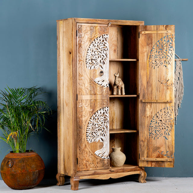 Side angle image with open doors of a artisanal Tree of Life furniture wardrobe with whitewashed carvings, handcrafted mango wood with four storage compartments, 90 × 40 × 180 cm.