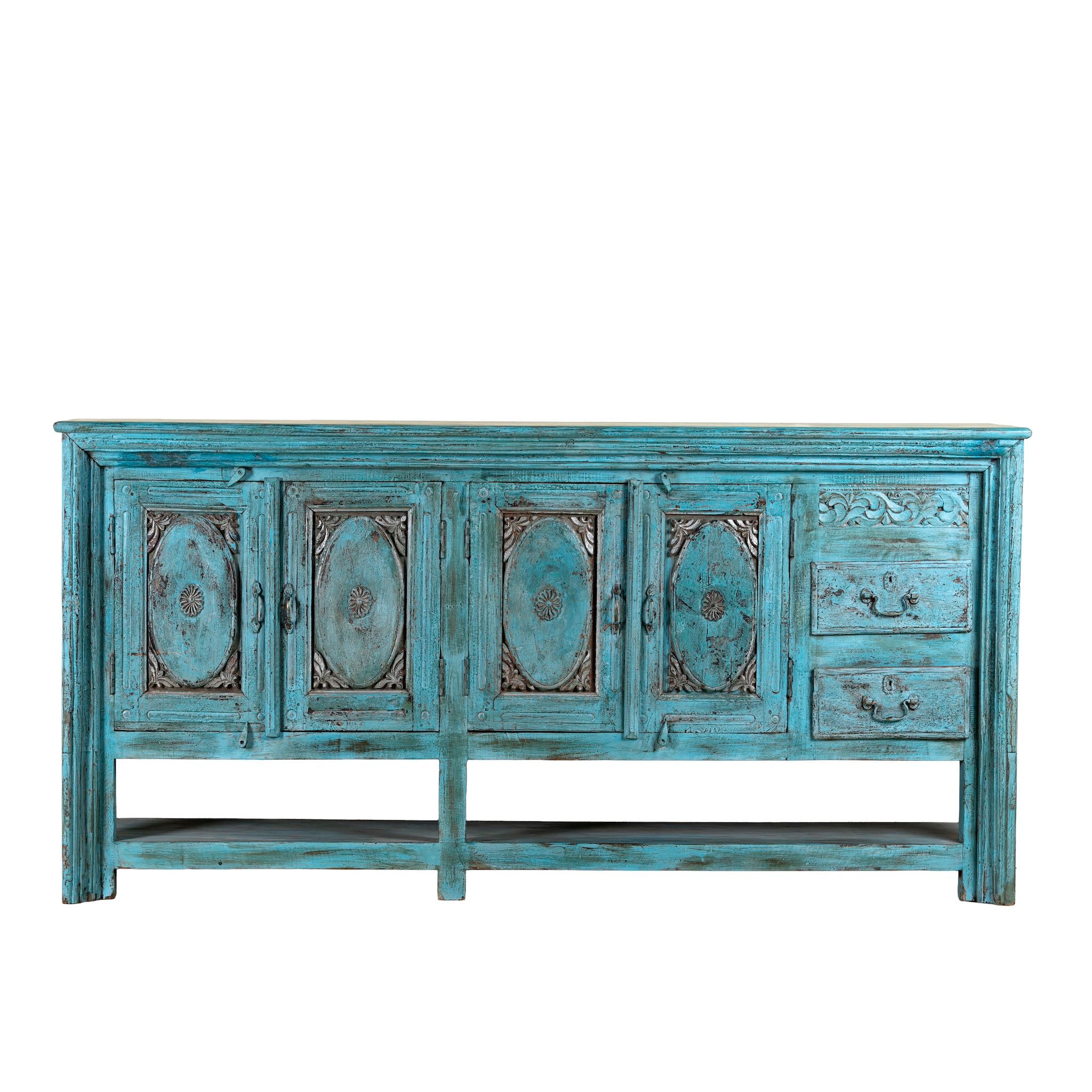 Vintage-style blue sideboard with decorative carvings on a white background