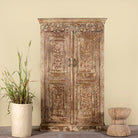 Hand-carved reclaimed wood wardrobe with vintage finish – a sustainable furniture piece ideal for Indian home decor and rustic interiors.