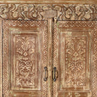 Close up image of a hand-carved reclaimed wood wardrobe with vintage finish – a sustainable furniture piece ideal for Indian home decor and rustic interiors.