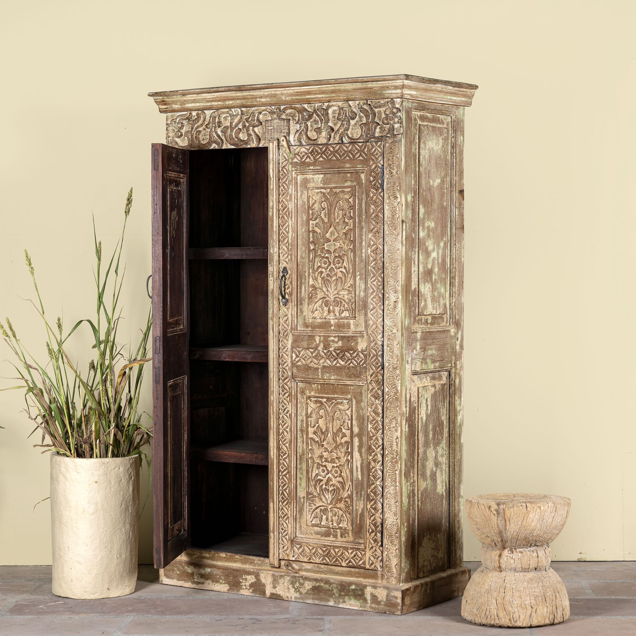 Side angle image showing pen door of a and-carved reclaimed wood wardrobe with vintage finish – a sustainable furniture piece ideal for Indian home decor and rustic interiors.