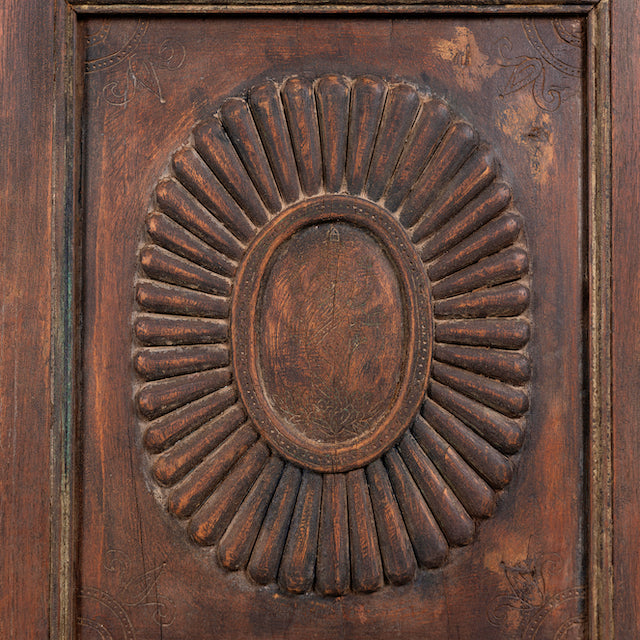 Close up image of a reclaimed teak wood display cabinet with glass doors – unique Indian furniture with natural wax finish and timeless craftsmanship.