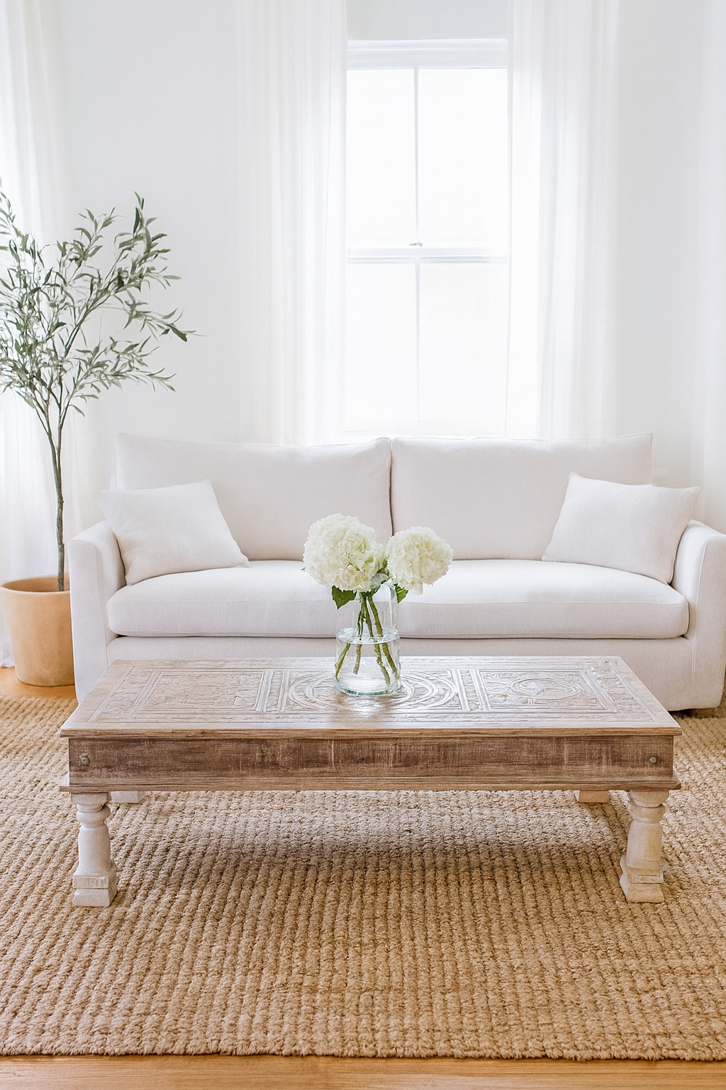 Lifestyle imagination of a Lata teak wood coffee table with antique carved door top, also ideal as an entryway table vintage statement piece.