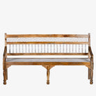 White background image of a and carved mango wood bench with floral backrest and spindle accents; rustic mango wood seating, 176 × 56 × 95 cm.