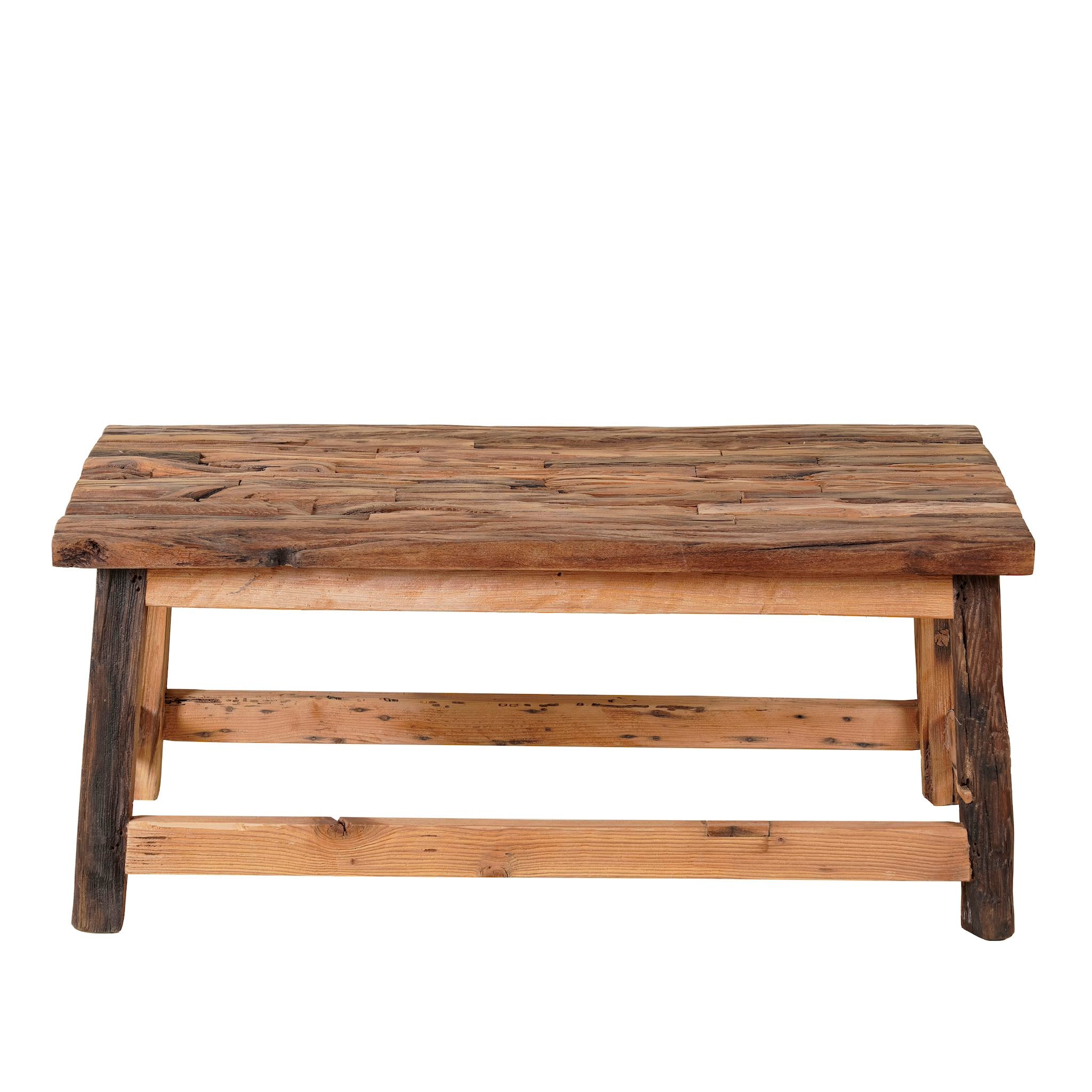 White background image of a rustic-style coffee table made from driftwood, showcasing a textured, uneven surface with natural wood tones and grain variations, supported by a sturdy, simple wooden frame, styled in a cozy minimal setting with neutral decor.
