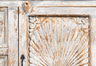 Close up image of a handcrafted carved sideboard made from solid mango wood with floral motifs, antique layered finish, and natural wood top; artisan vintage furniture, 150 × 40 × 90 cm.