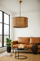 Lifestyle image of a large rustic pendant lamp made of natural mango wood with brass-clad edges – minimalistic style lighting ideal for dining rooms, kitchens, or spacious living areas.